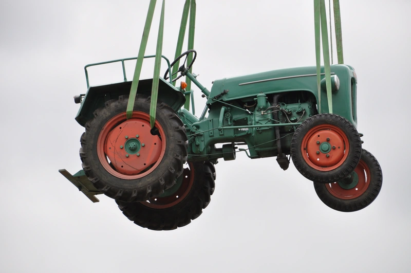 Tractor is lifted using lifting slings