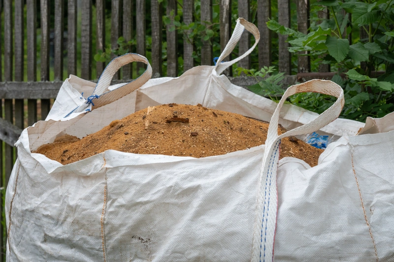Mit Schüttgut befüllte Sandax-Big Bag
